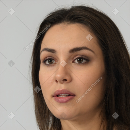 Neutral white young-adult female with long  brown hair and brown eyes