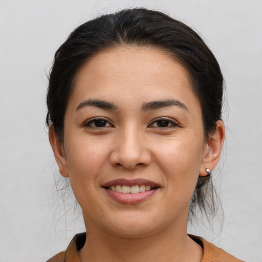 Joyful white young-adult female with medium  brown hair and brown eyes