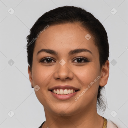 Joyful latino young-adult female with short  brown hair and brown eyes