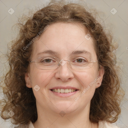 Joyful white adult female with medium  brown hair and blue eyes