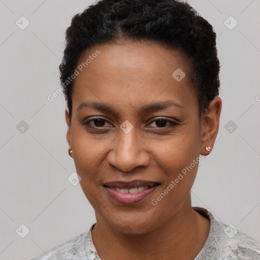 Joyful black young-adult female with short  black hair and brown eyes