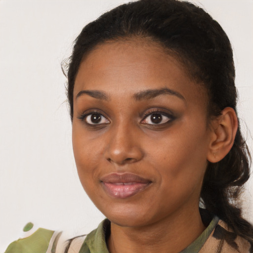 Joyful black young-adult female with medium  black hair and brown eyes