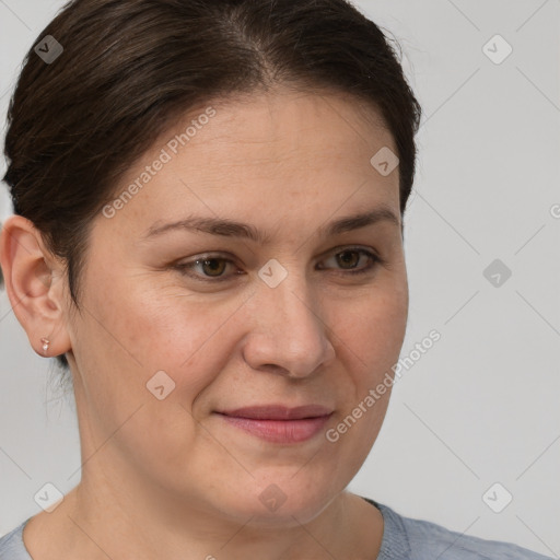 Joyful white adult female with short  brown hair and brown eyes