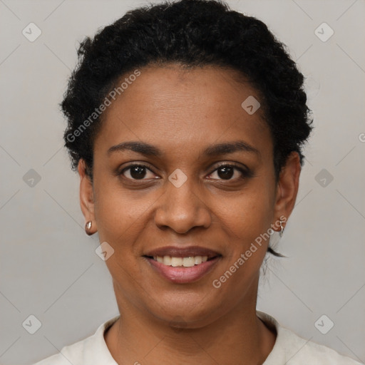 Joyful black young-adult female with short  black hair and brown eyes