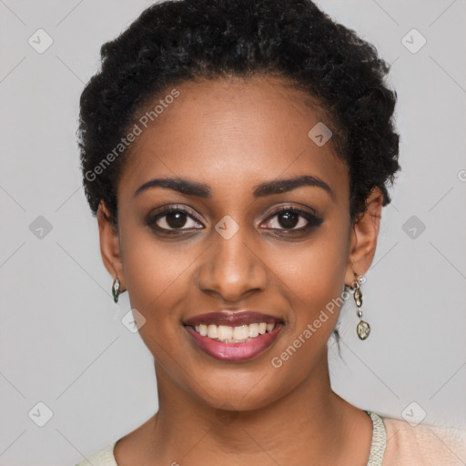 Joyful black young-adult female with short  black hair and brown eyes