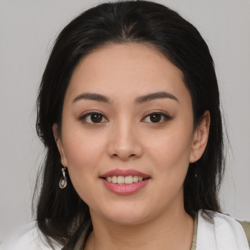 Joyful asian young-adult female with medium  brown hair and brown eyes