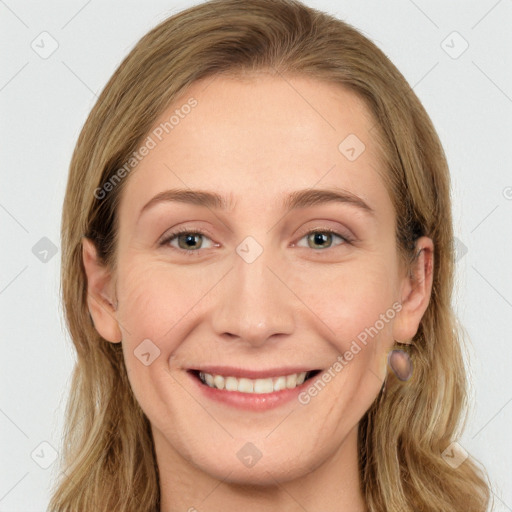 Joyful white young-adult female with long  brown hair and blue eyes