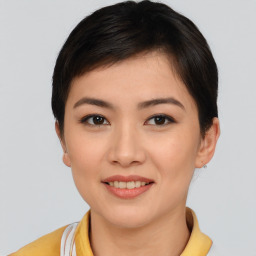 Joyful asian young-adult female with short  brown hair and brown eyes