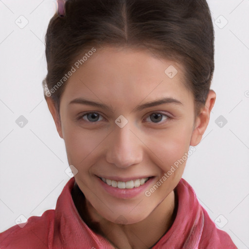 Joyful white child female with short  brown hair and brown eyes