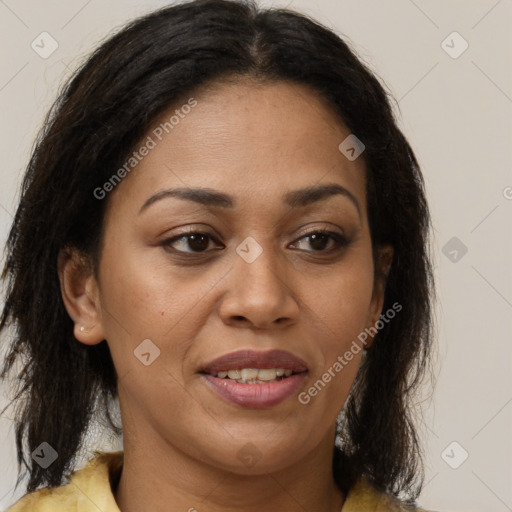 Joyful black adult female with medium  brown hair and brown eyes