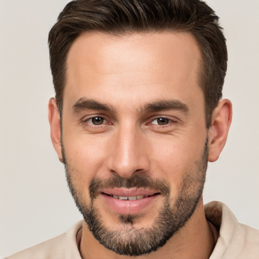 Joyful white young-adult male with short  brown hair and brown eyes