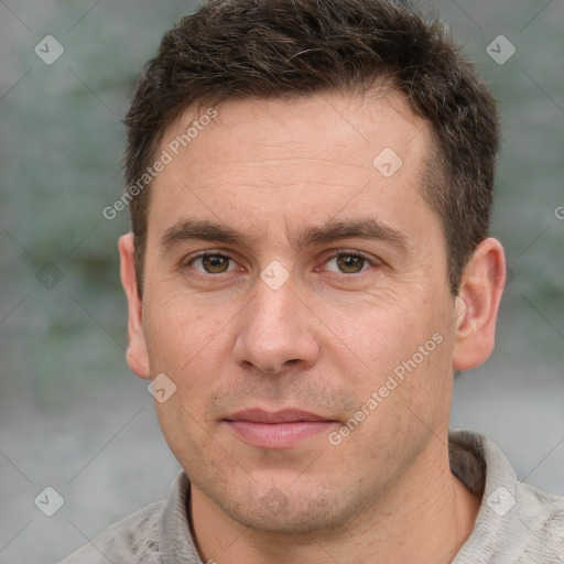 Joyful white adult male with short  brown hair and grey eyes