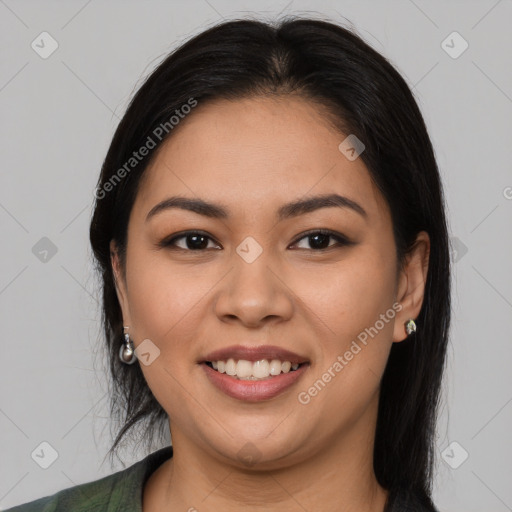 Joyful latino young-adult female with long  brown hair and brown eyes