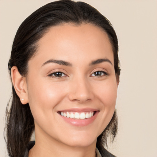 Joyful white young-adult female with medium  brown hair and brown eyes