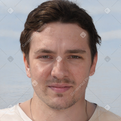 Joyful white young-adult male with short  brown hair and brown eyes