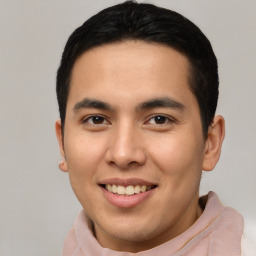 Joyful latino young-adult male with short  brown hair and brown eyes