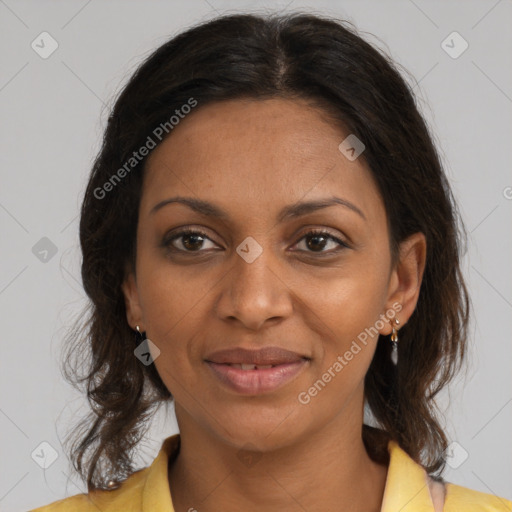 Joyful black adult female with medium  brown hair and brown eyes