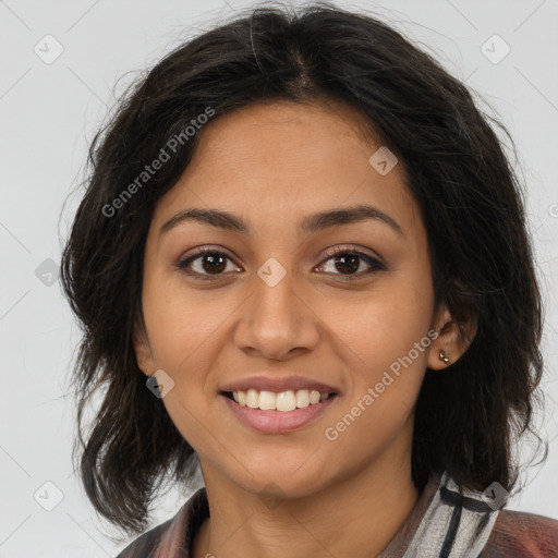 Joyful latino young-adult female with medium  brown hair and brown eyes