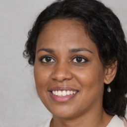 Joyful black young-adult female with medium  brown hair and brown eyes