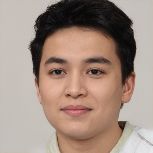 Joyful asian young-adult male with short  black hair and brown eyes