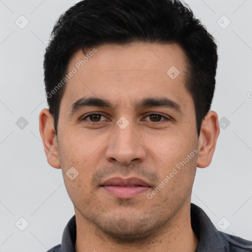 Joyful white young-adult male with short  black hair and brown eyes