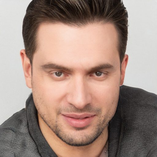 Joyful white young-adult male with short  brown hair and brown eyes