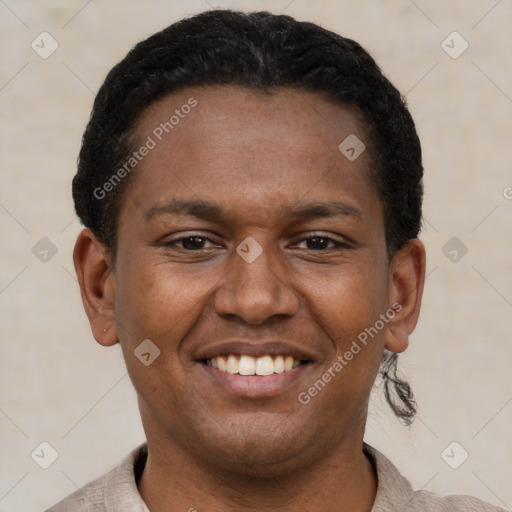 Joyful latino young-adult male with short  brown hair and brown eyes