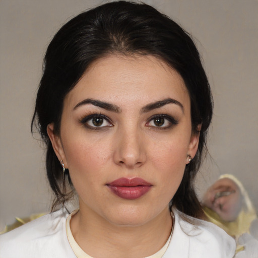 Joyful white young-adult female with medium  black hair and brown eyes