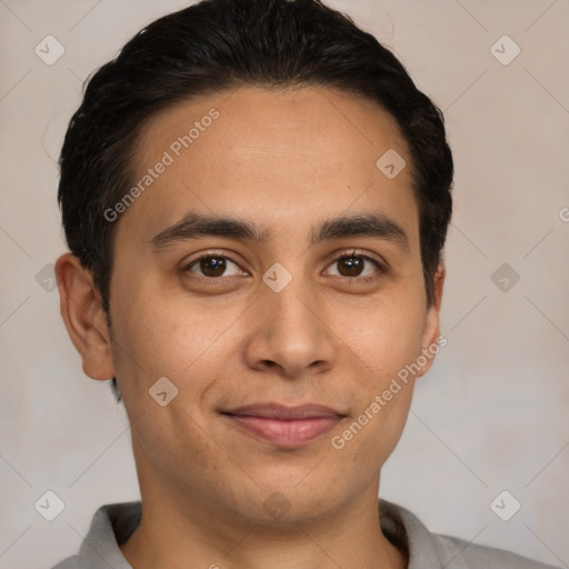 Joyful latino young-adult male with short  brown hair and brown eyes