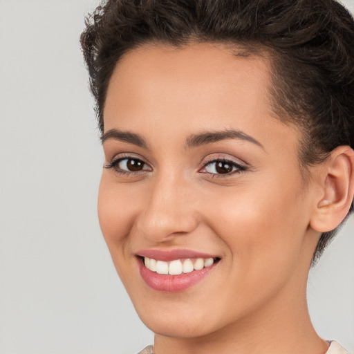 Joyful white young-adult female with short  brown hair and brown eyes