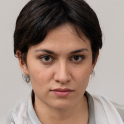 Neutral white young-adult female with medium  brown hair and brown eyes