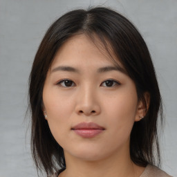 Neutral asian young-adult female with medium  brown hair and brown eyes