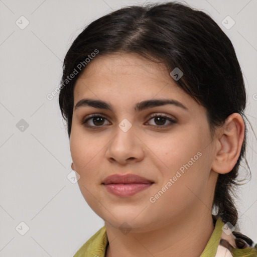 Joyful latino young-adult female with medium  brown hair and brown eyes