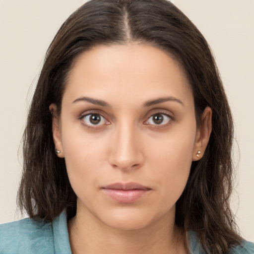 Neutral white young-adult female with long  brown hair and brown eyes