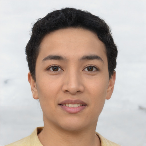 Joyful asian young-adult male with short  black hair and brown eyes