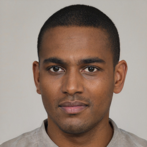 Neutral black young-adult male with short  black hair and brown eyes