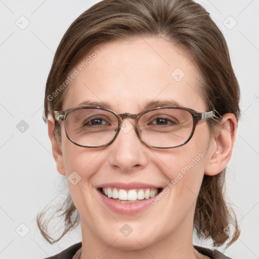 Joyful white adult female with medium  brown hair and grey eyes