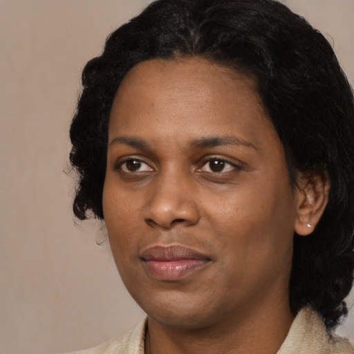 Joyful black young-adult female with medium  black hair and brown eyes