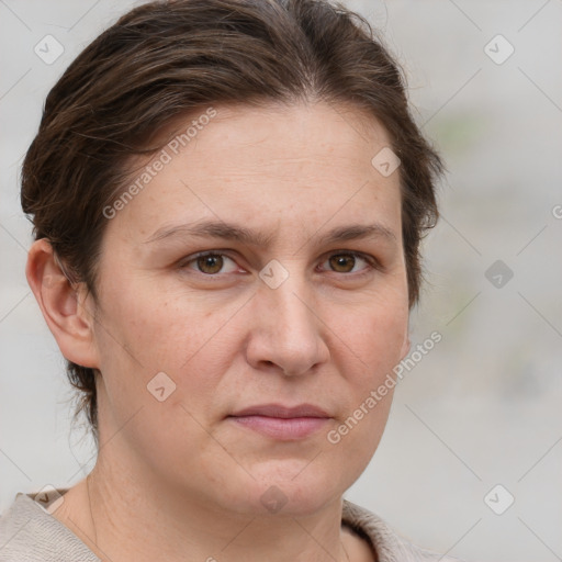 Joyful white adult female with short  brown hair and grey eyes