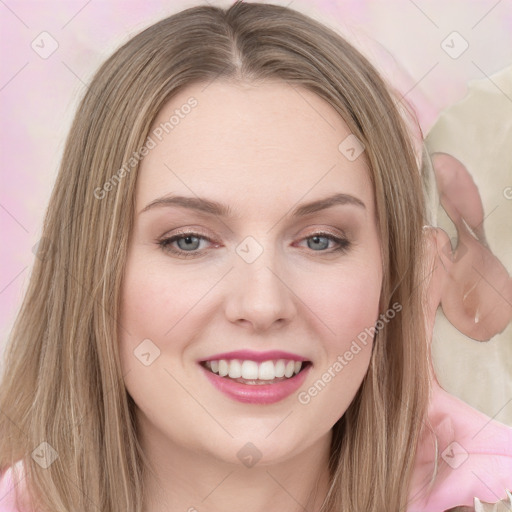 Joyful white young-adult female with long  brown hair and blue eyes