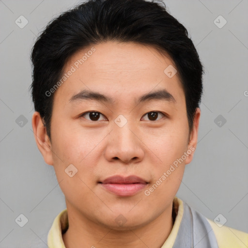 Joyful asian young-adult male with short  brown hair and brown eyes