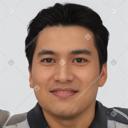 Joyful asian young-adult male with short  black hair and brown eyes