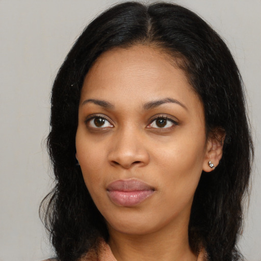 Joyful latino young-adult female with long  black hair and brown eyes