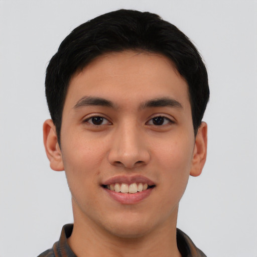 Joyful asian young-adult male with short  black hair and brown eyes