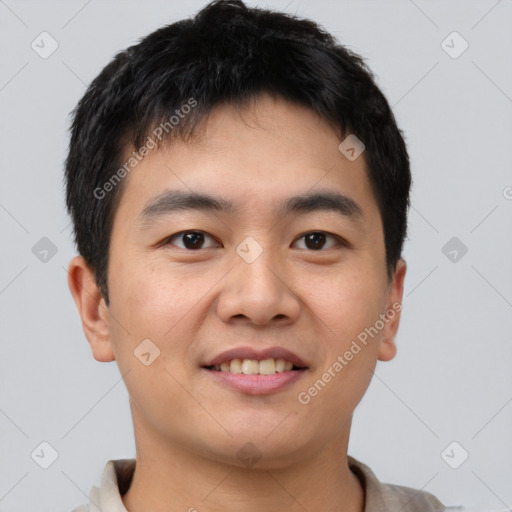 Joyful asian young-adult male with short  brown hair and brown eyes