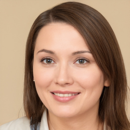 Joyful white young-adult female with long  brown hair and brown eyes