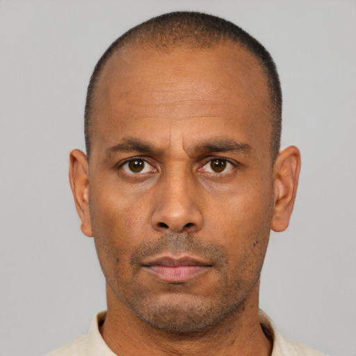 Neutral latino adult male with short  black hair and brown eyes