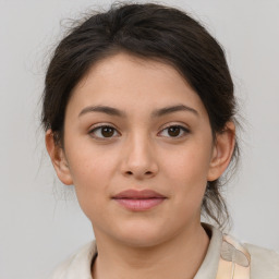 Joyful white young-adult female with medium  brown hair and brown eyes