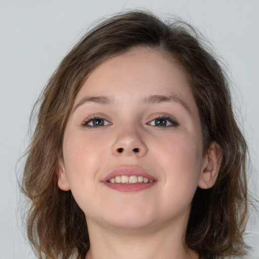 Joyful white child female with medium  brown hair and grey eyes