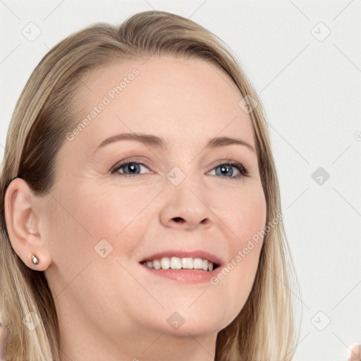 Joyful white young-adult female with long  brown hair and blue eyes